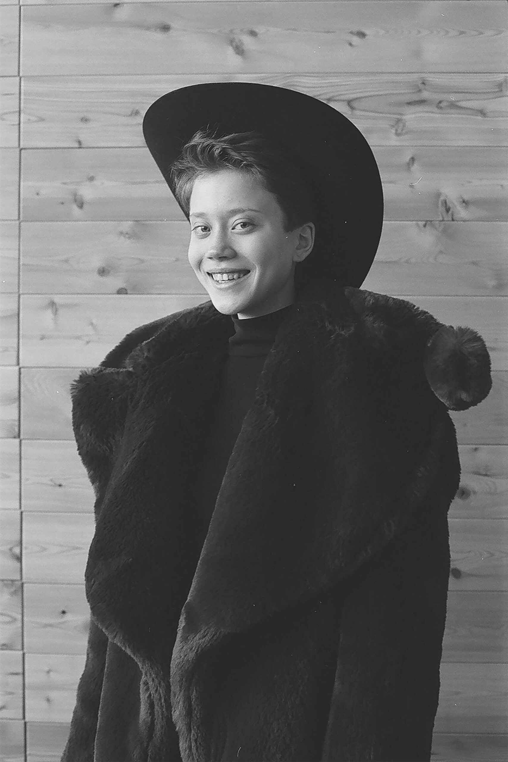 black faux-fur coat and hat