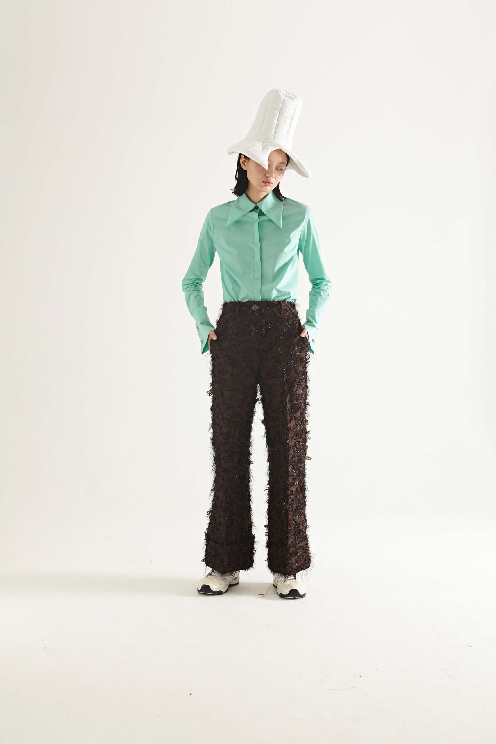 green collared shirt with brown flared pants