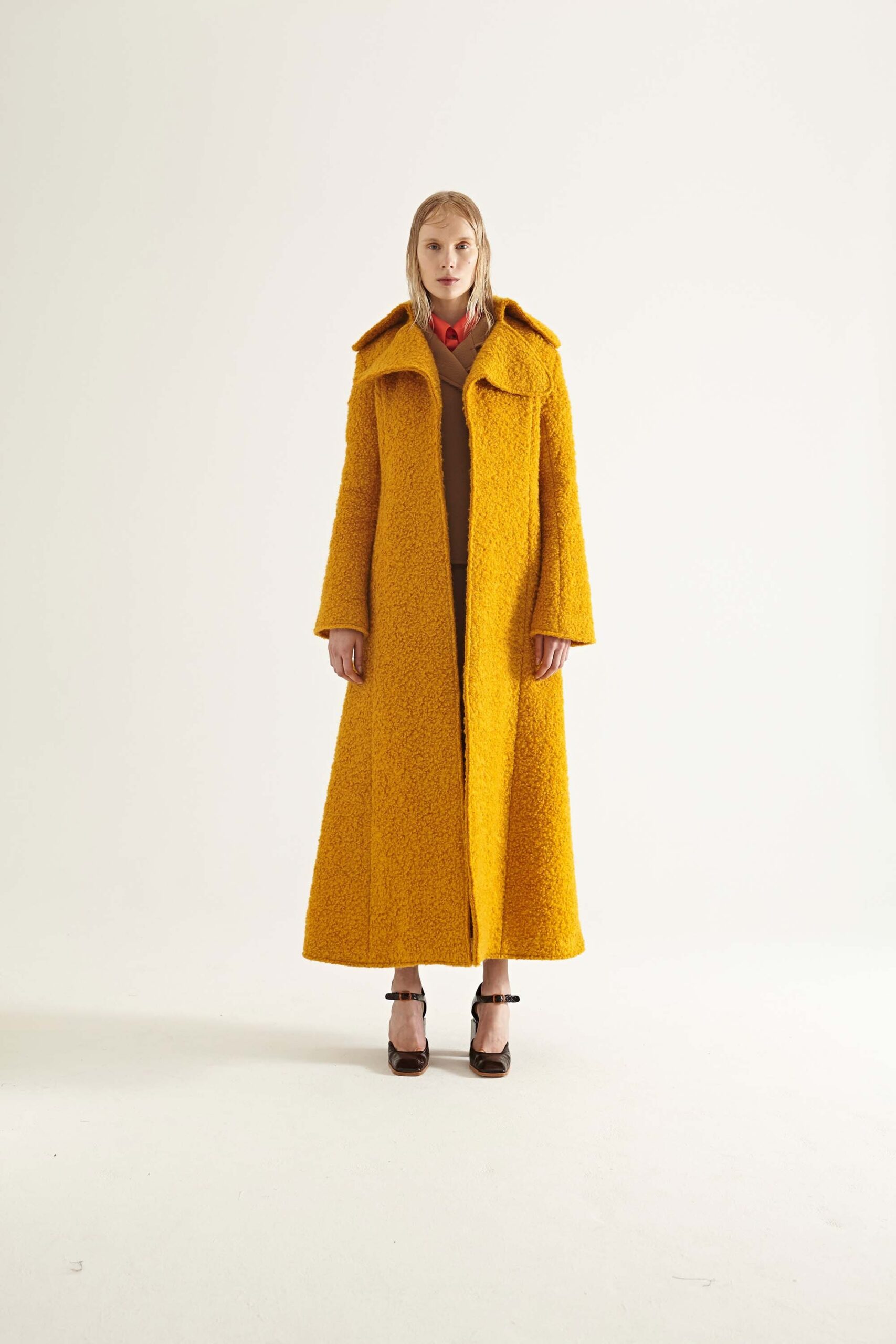 yellow wool relaxed coat and brown top