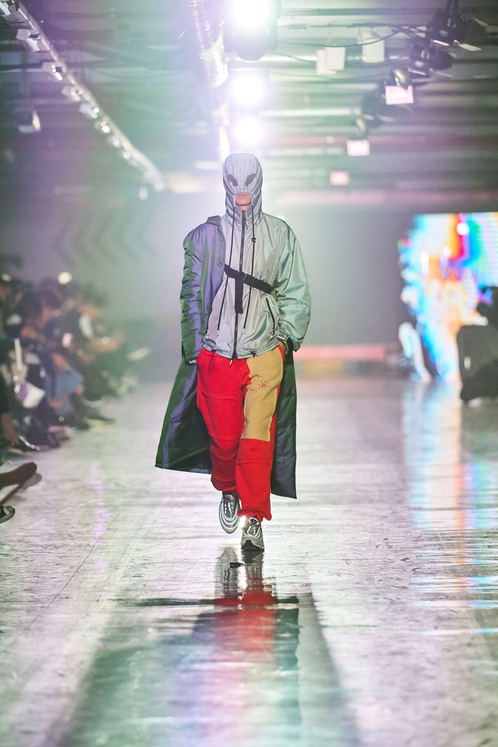 gray vinyl coat with red pants