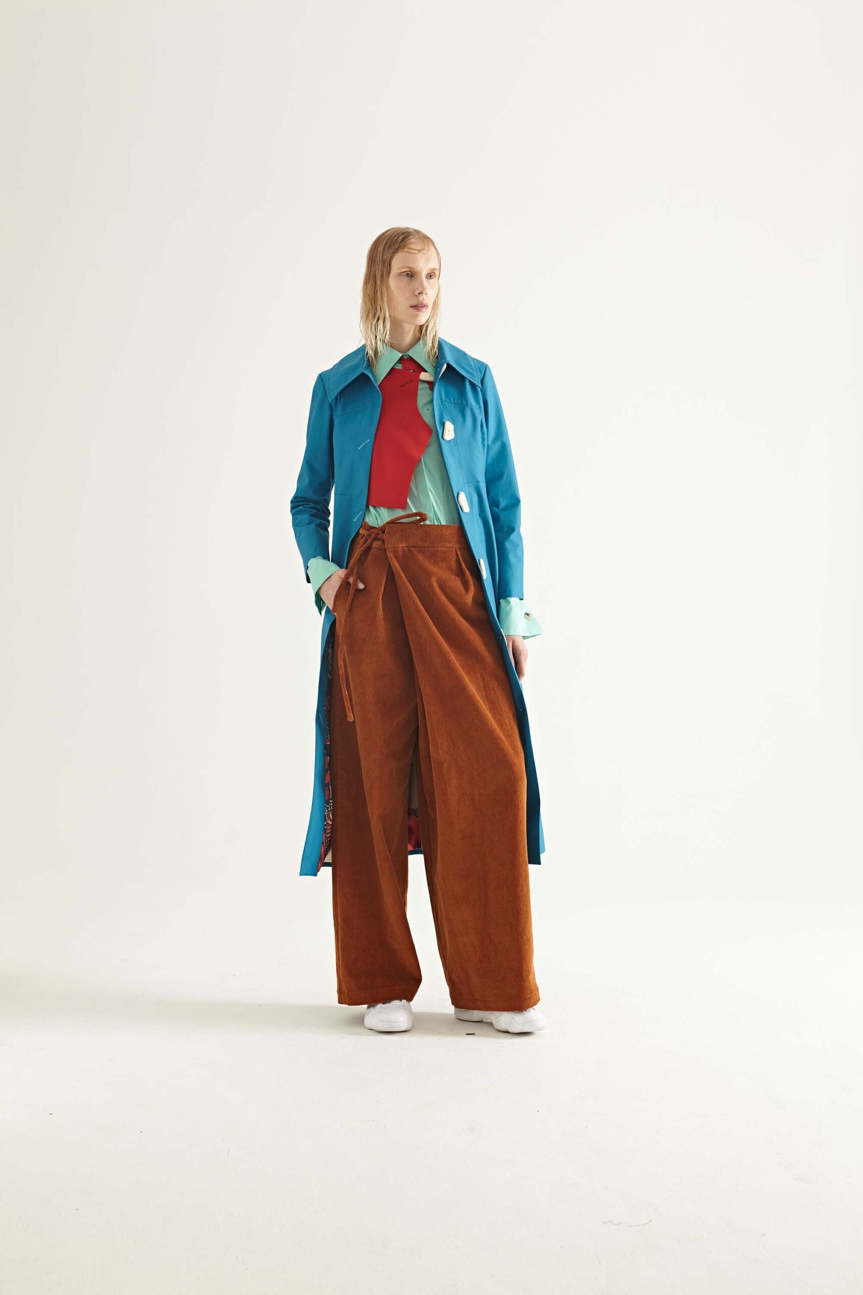 blue vinyl coat with green shirt