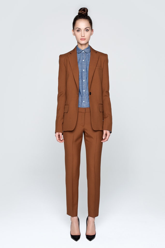 brown tailored suit with blue shirt