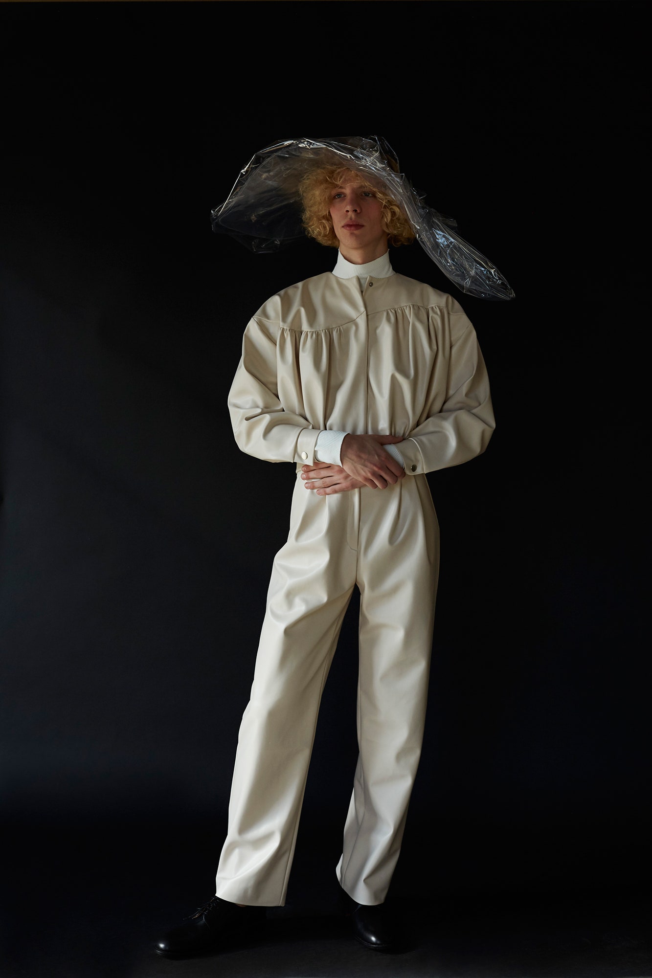 white relaxed jumpsuit with clear hat