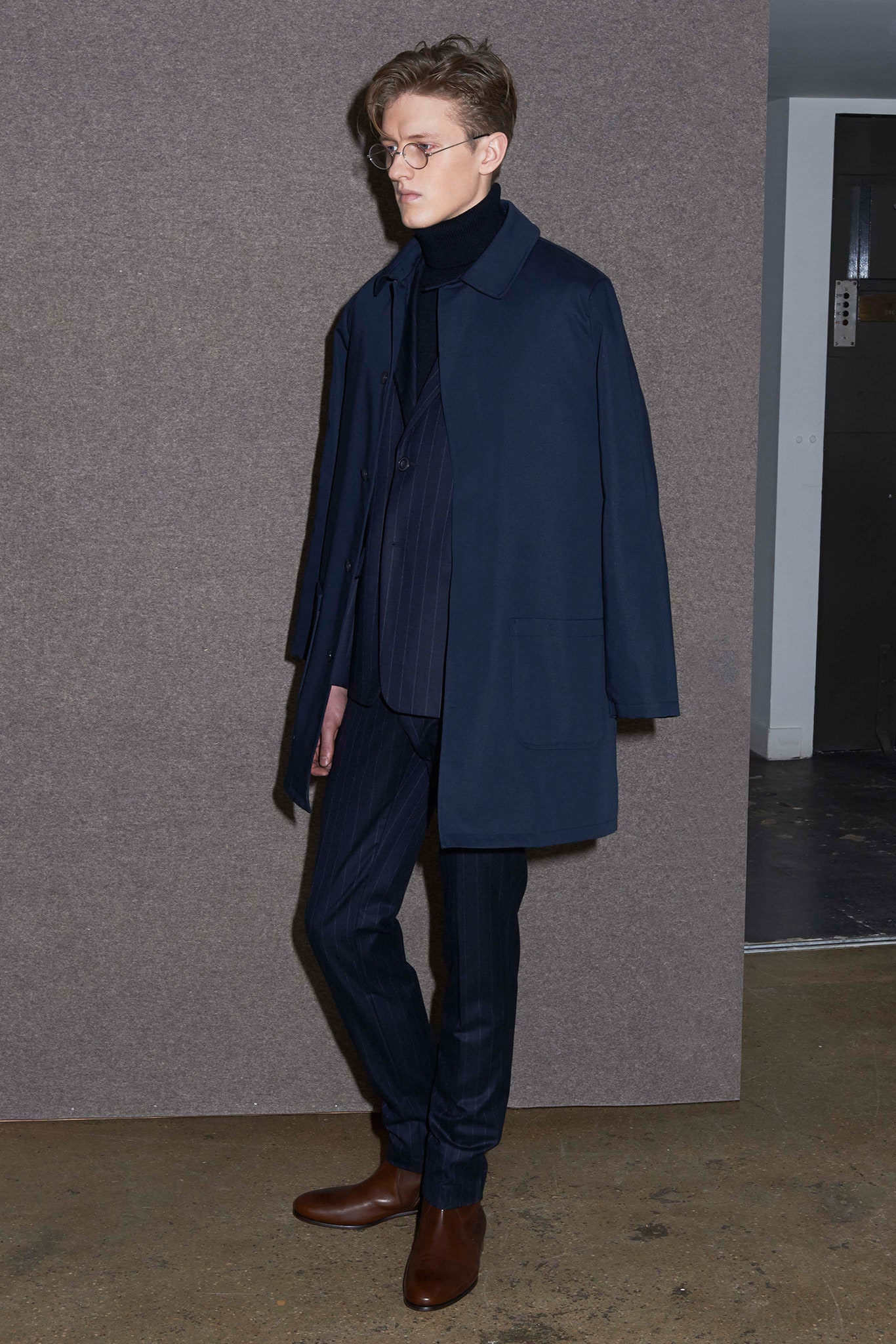 blue coat and suit with brown shoes