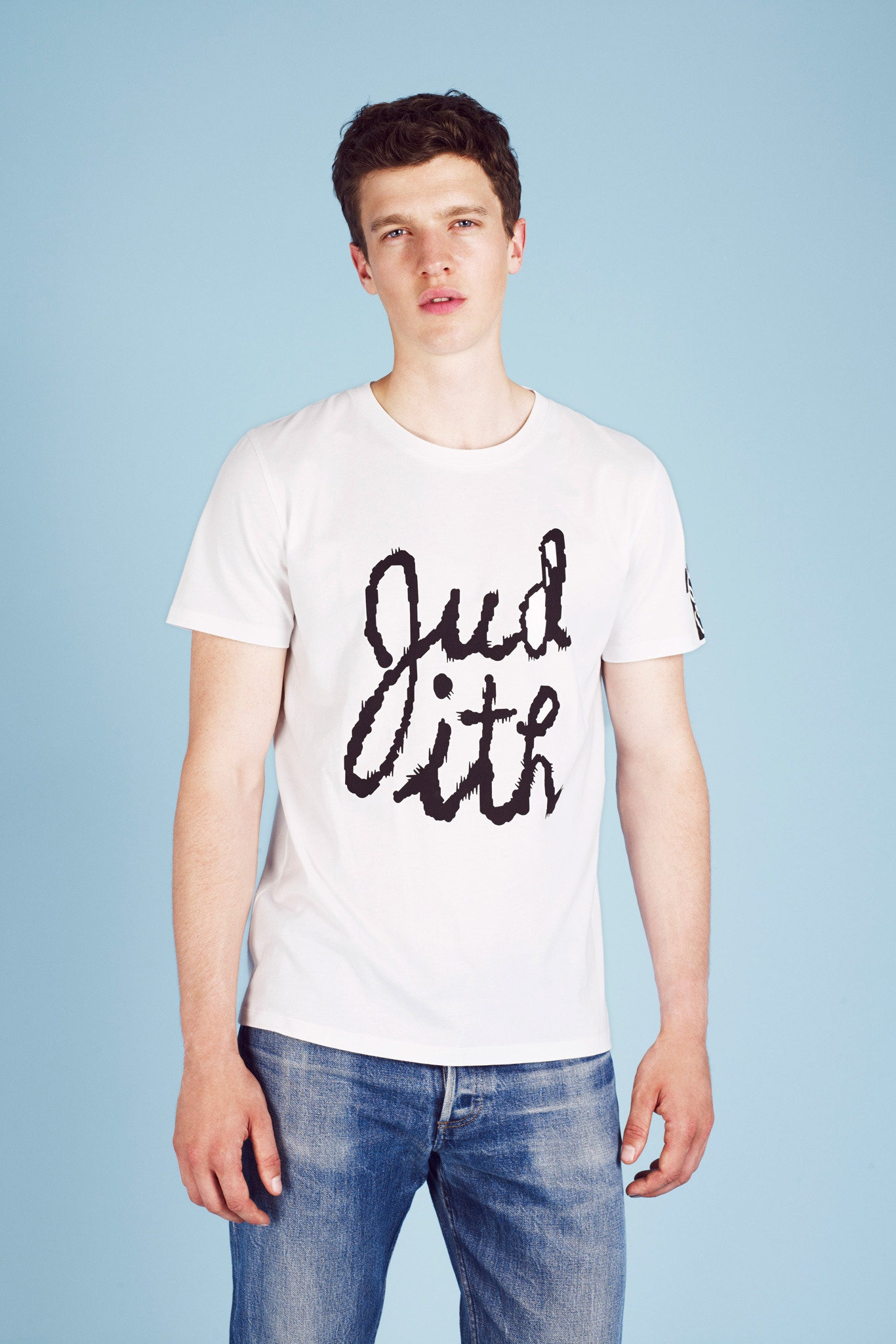white printed t-shirt and blue jeans
