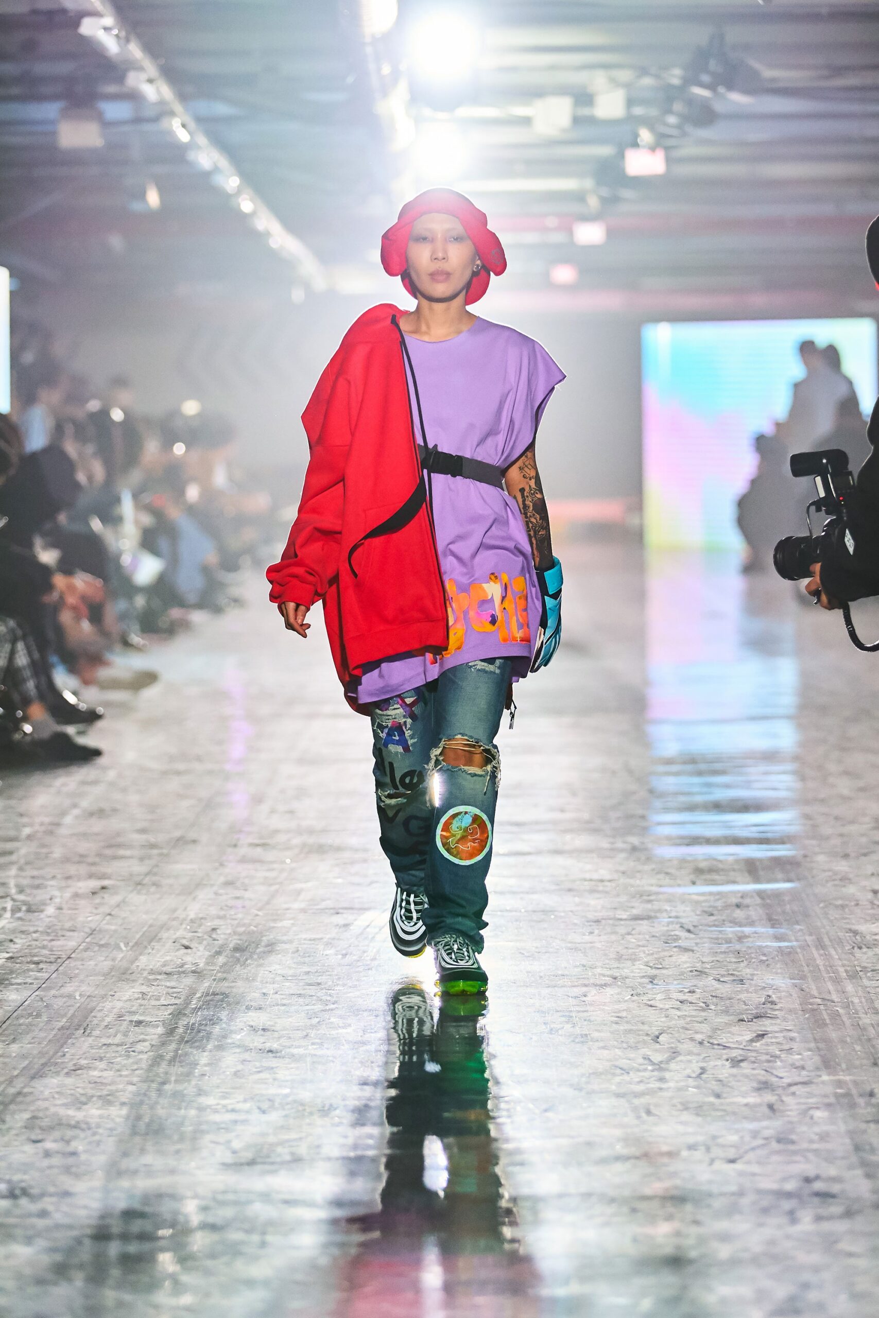 A relaxed purple shirt paired with a vibrant red jacket, featuring a printed design.