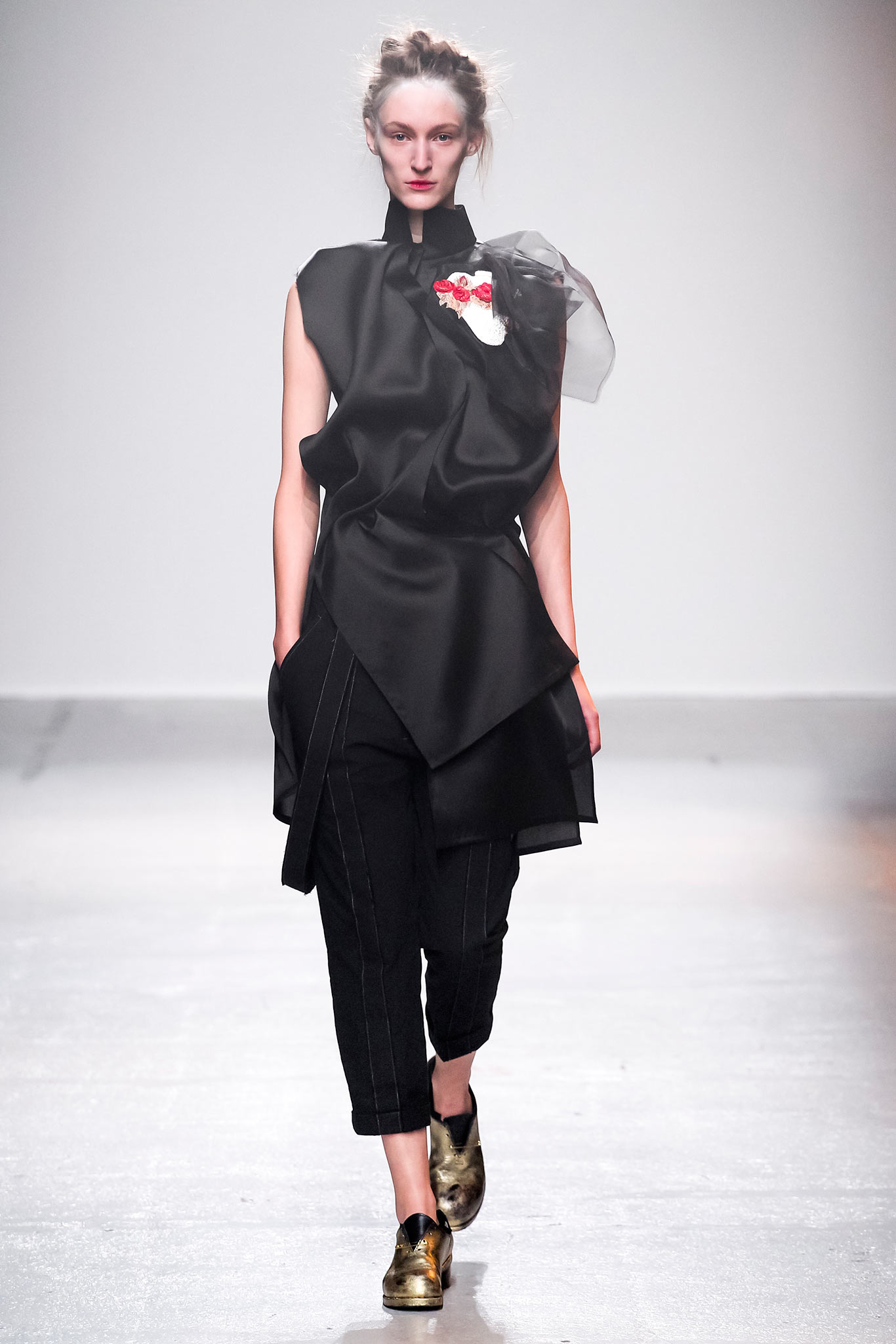 black draped top with tailored pants