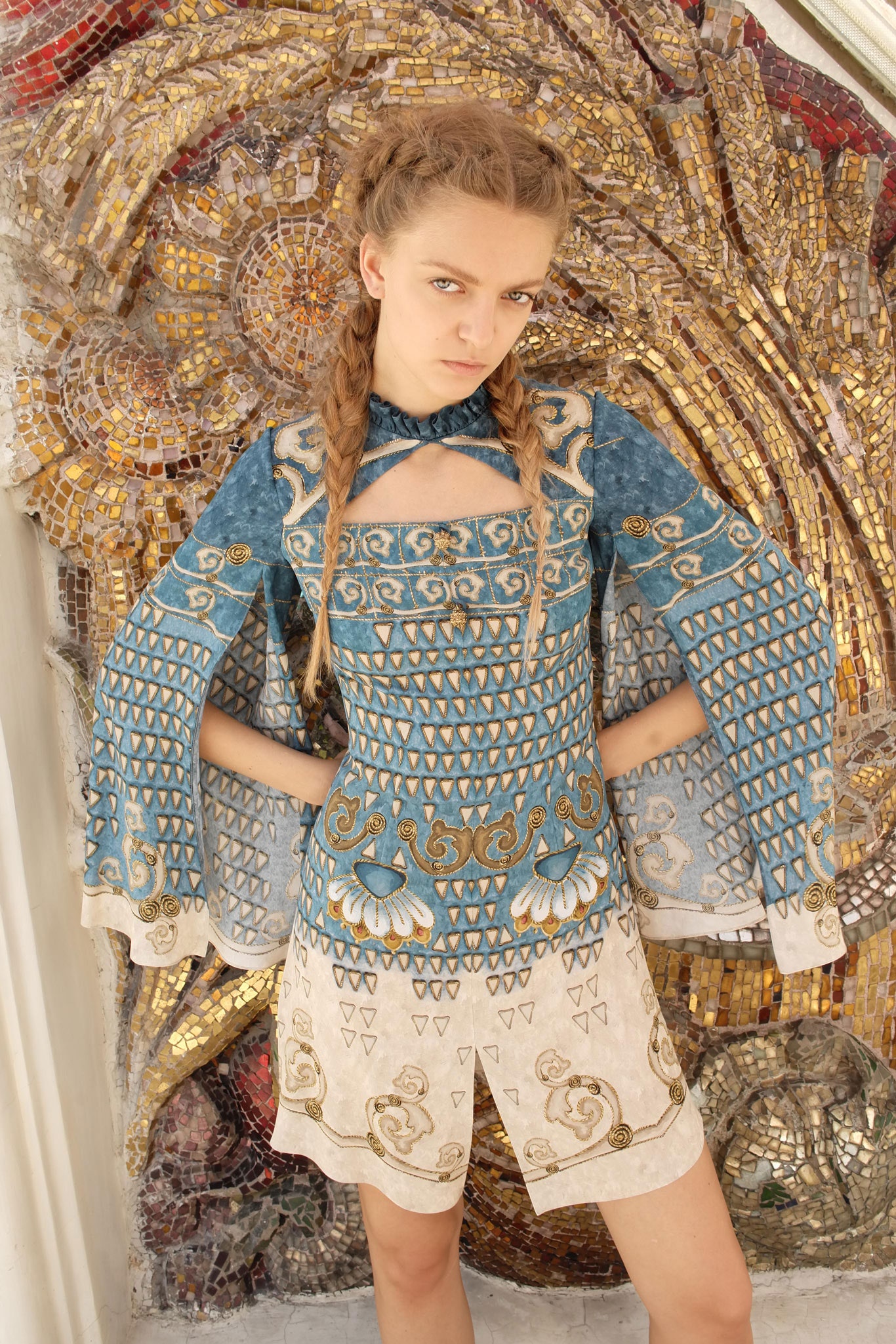 blue embroidered top with beige shorts