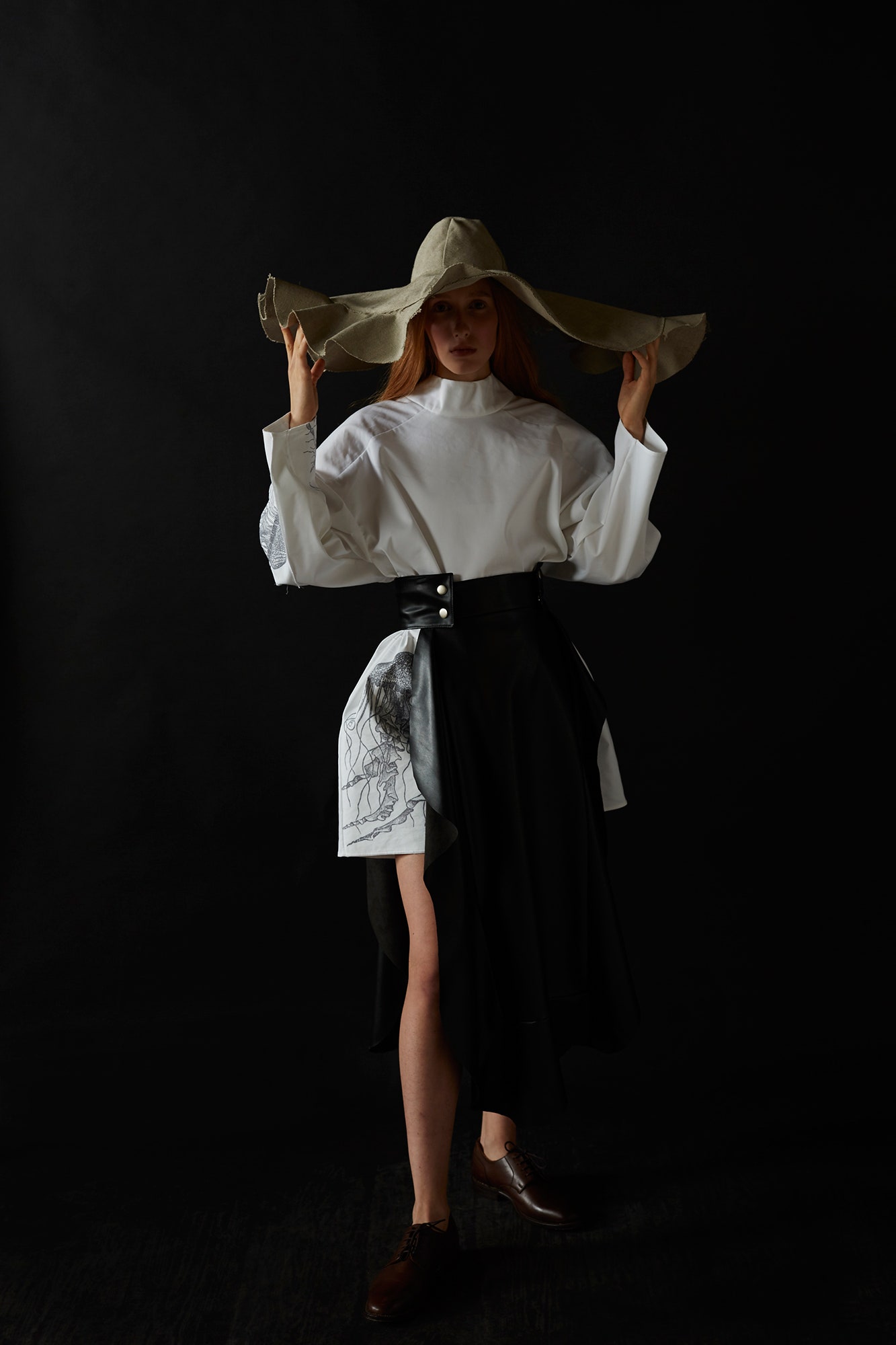 white blouse black asymmetric skirt