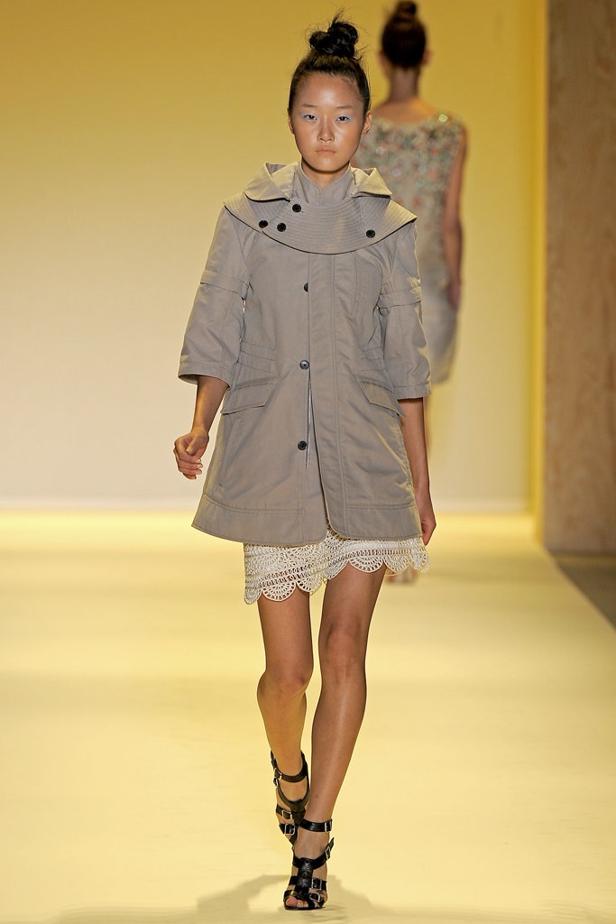 beige coat over white mini dress