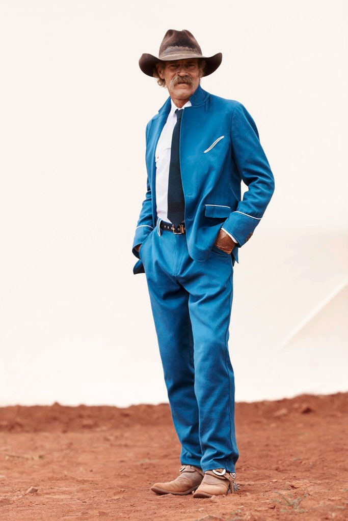 blue tailored suit with hat