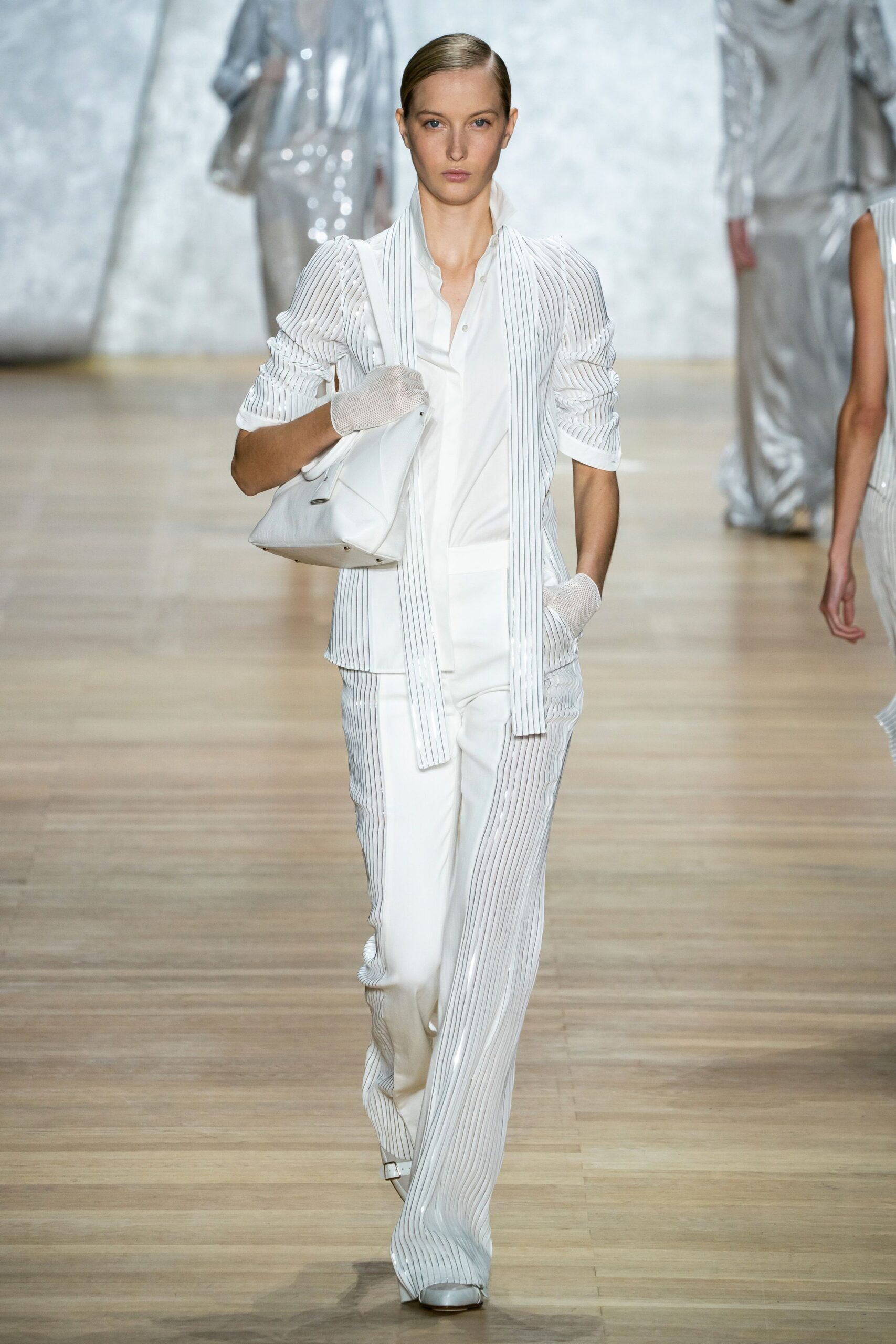 white fitted suit with gloves