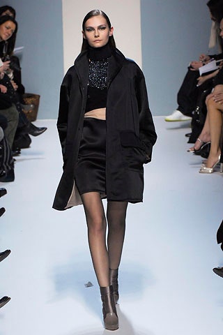black silk sleeveless high-neck fitted embellished top