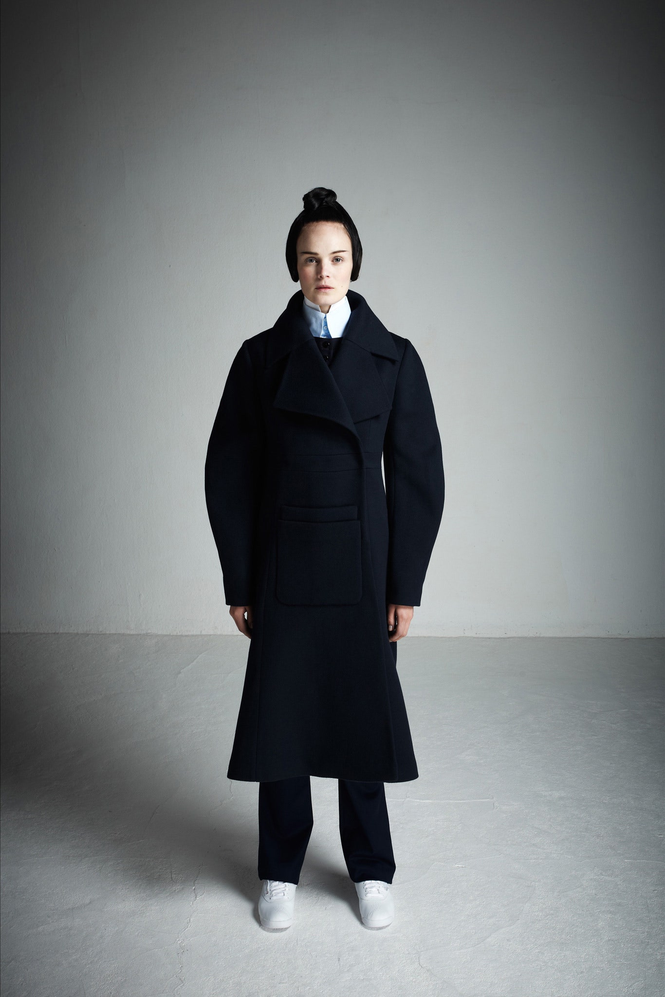 black wool coat with tailored pants