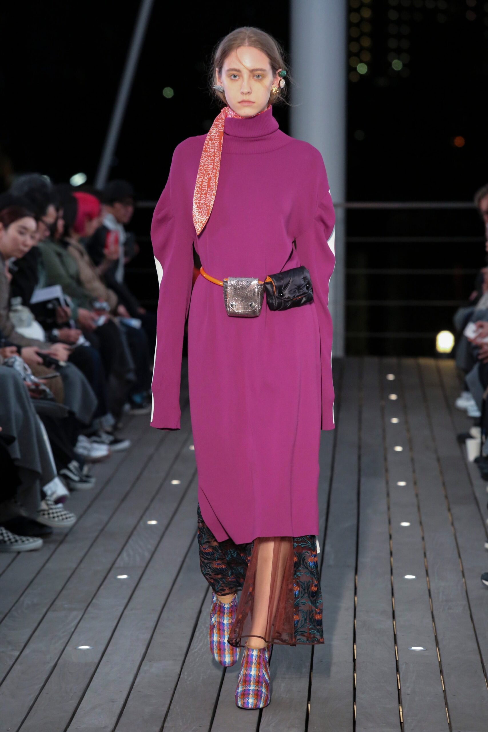 A relaxed purple silk dress with long sleeves and a turtleneck, featuring a layered design.
