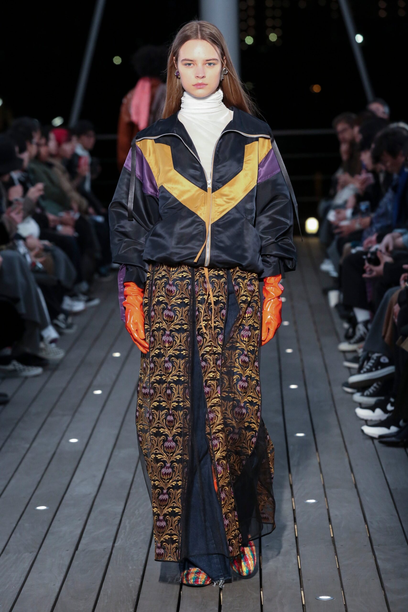 color-blocked jacket with pleated skirt