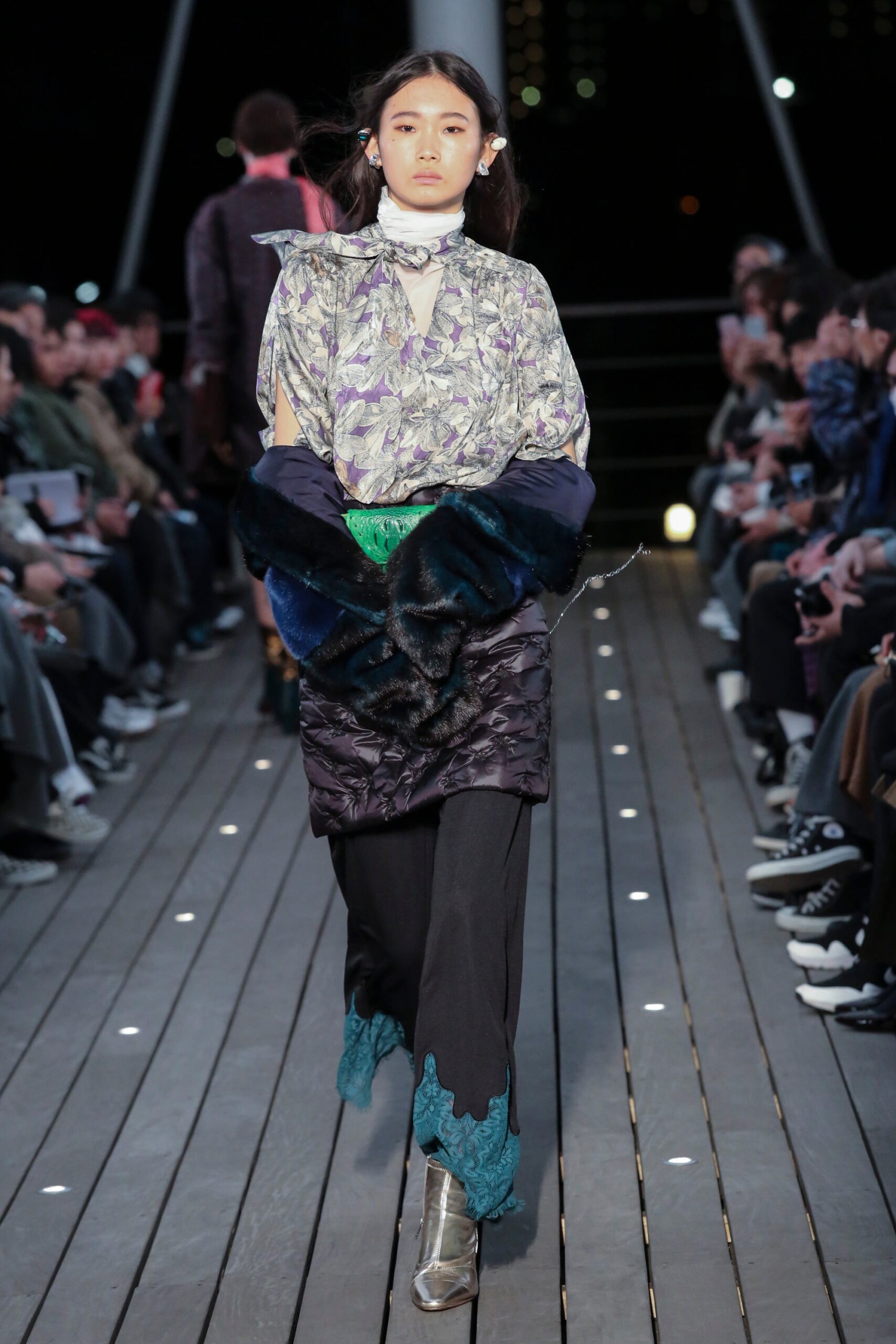 A relaxed purple and black layered dress with long sleeves and a V-neckline.