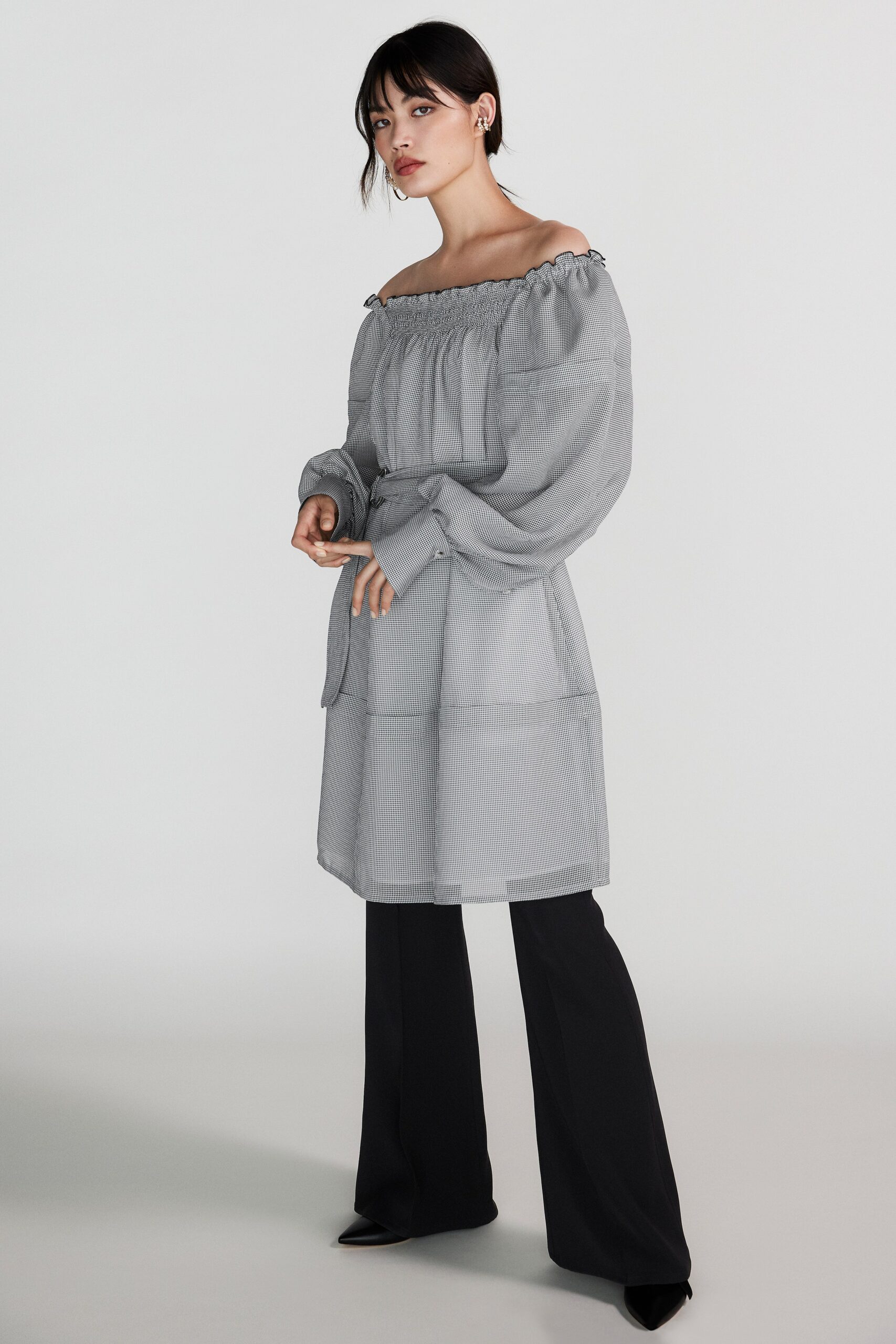 gray off-shoulder midi dress with black tailored pants