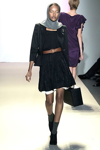 black tailored blazer with pleated skirt