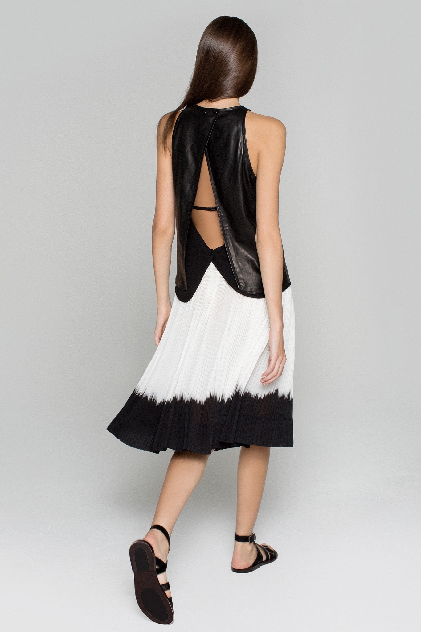 black leather top and pleated skirt
