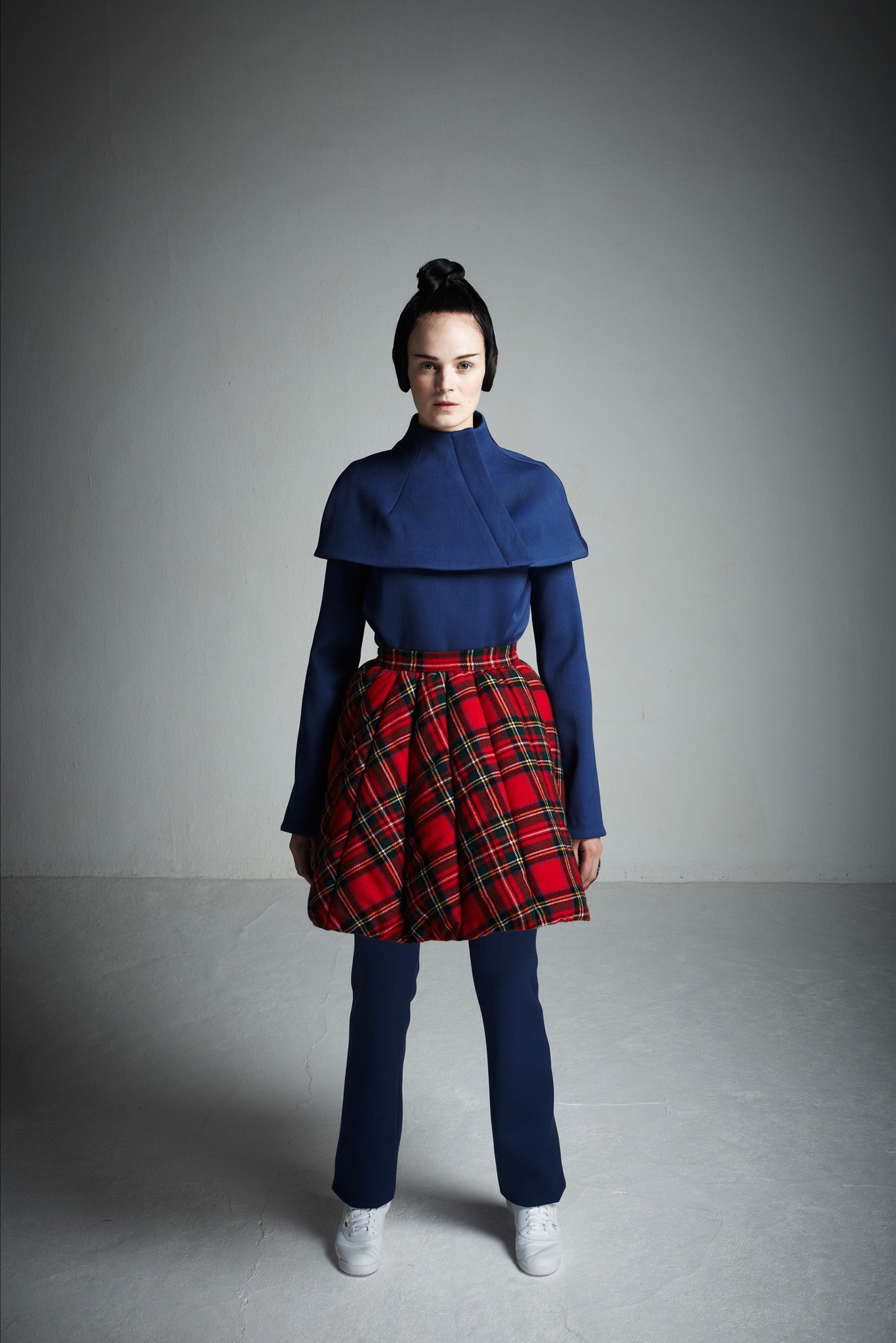 blue top with pleated red skirt