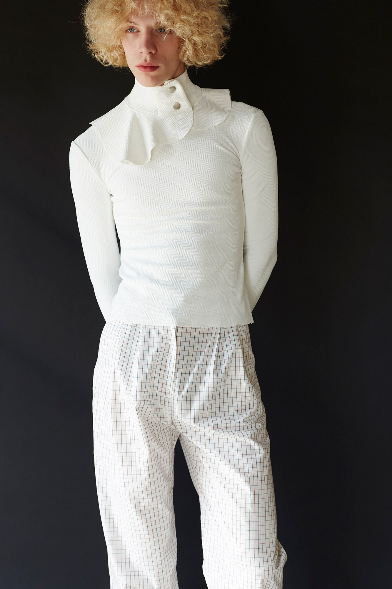 white fitted top with checked pants