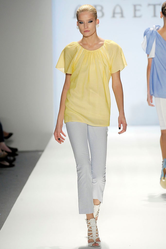 yellow relaxed top with white pants