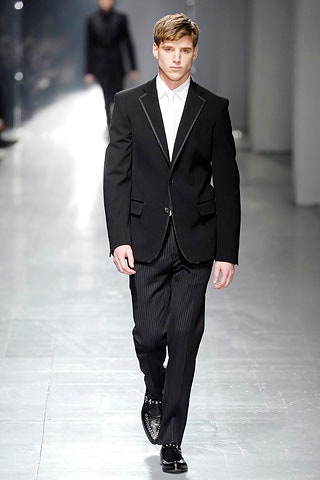 black tailored suit with striped pants