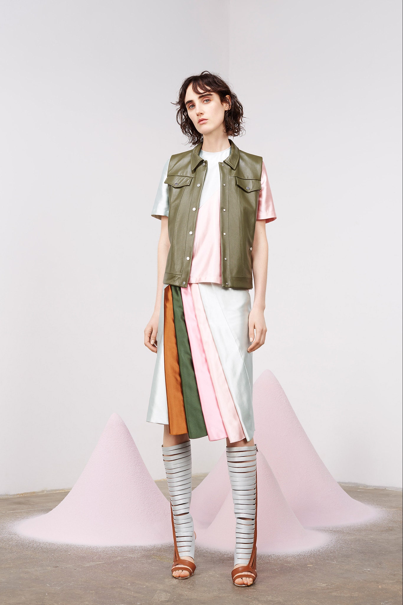 green leather vest with pleated skirt