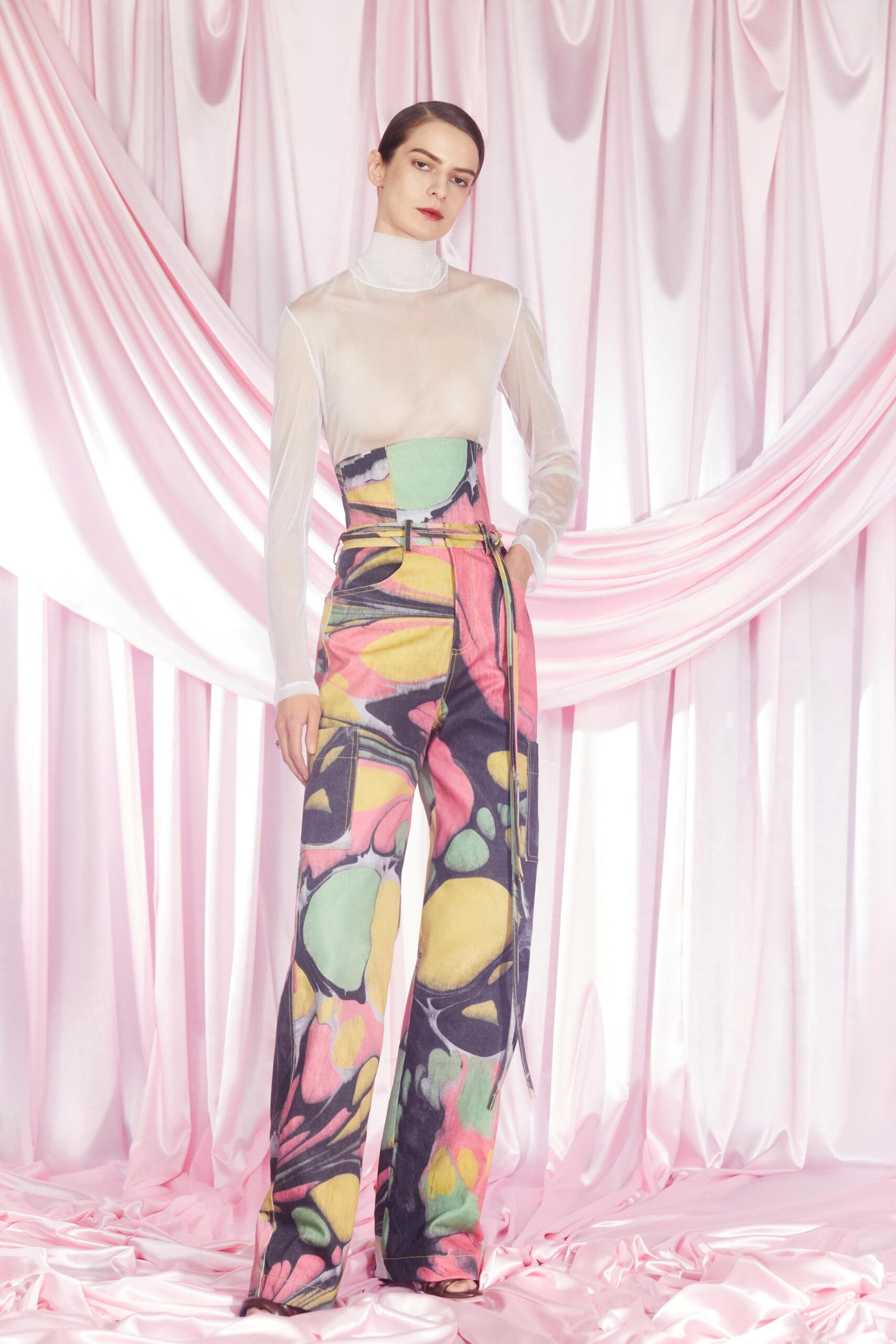 sheer white turtleneck top with colorful pants