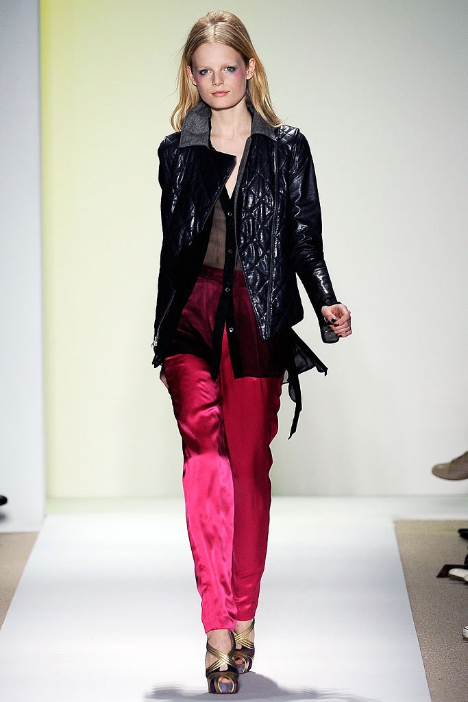 black leather fitted jacket and red silk pants