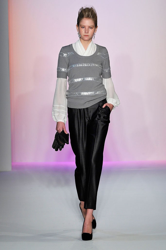 gray and white sequined top with black pants
