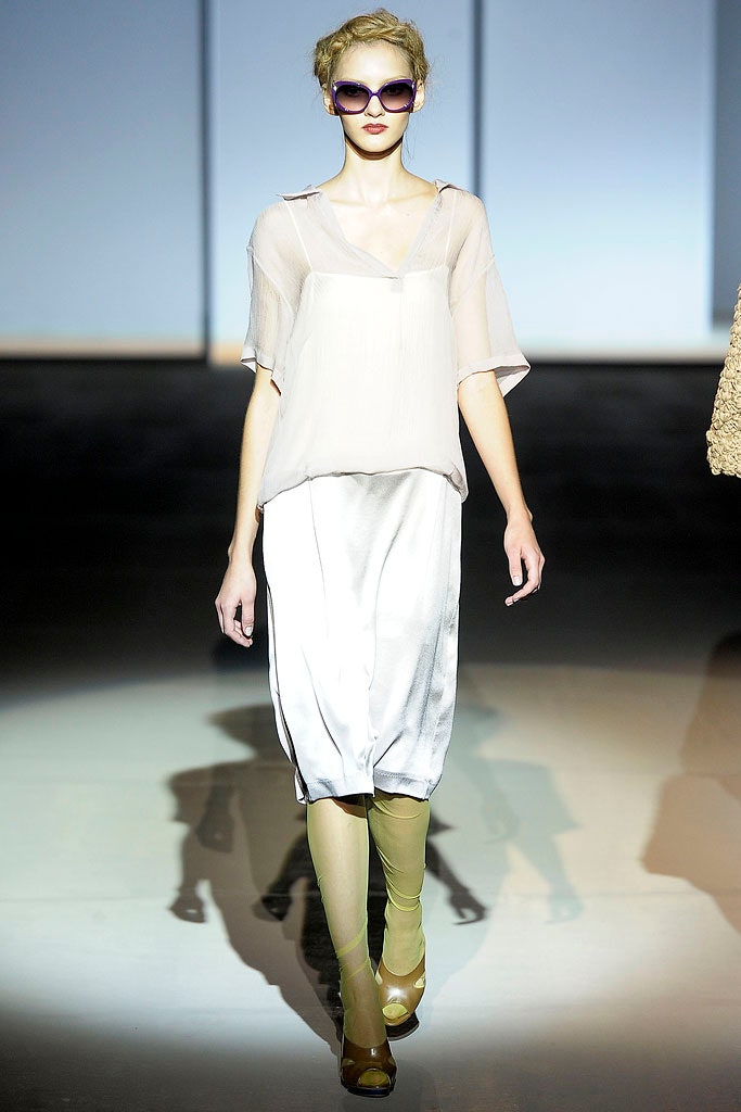 white silk relaxed top with gray skirt
