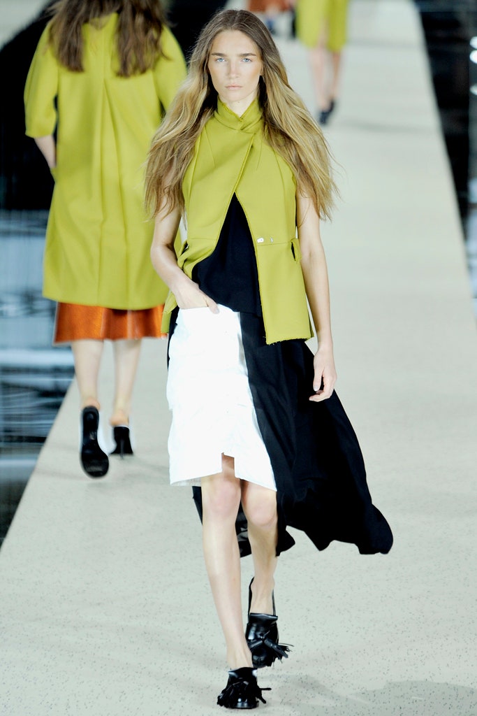 green sleeveless top with asymmetric skirt