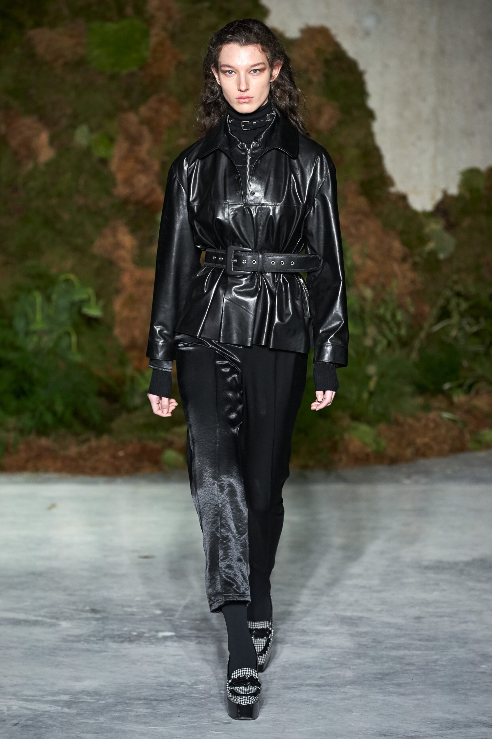 black leather belted jacket and silk pants