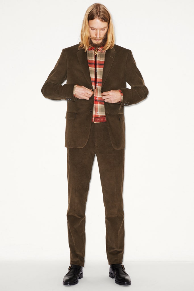 brown tailored suit with checked shirt