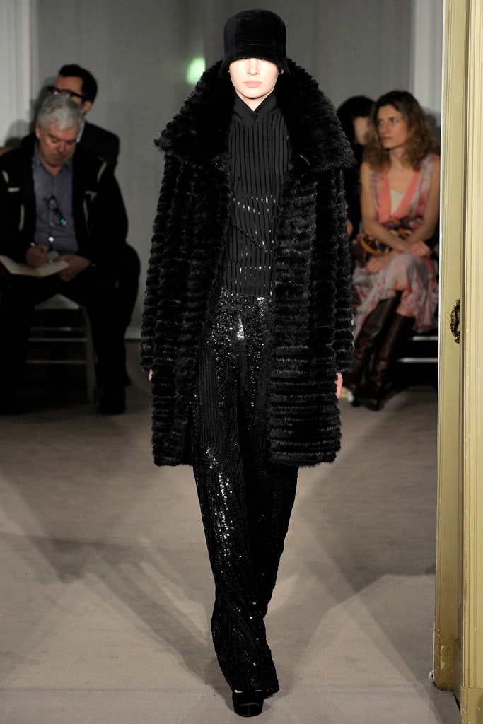 black faux-fur coat with sequined pants