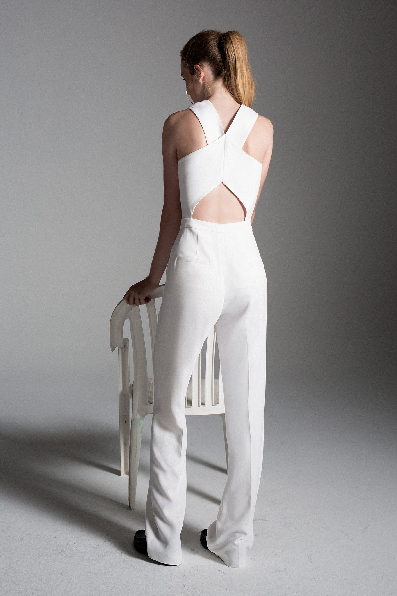 white fitted sleeveless jumpsuit