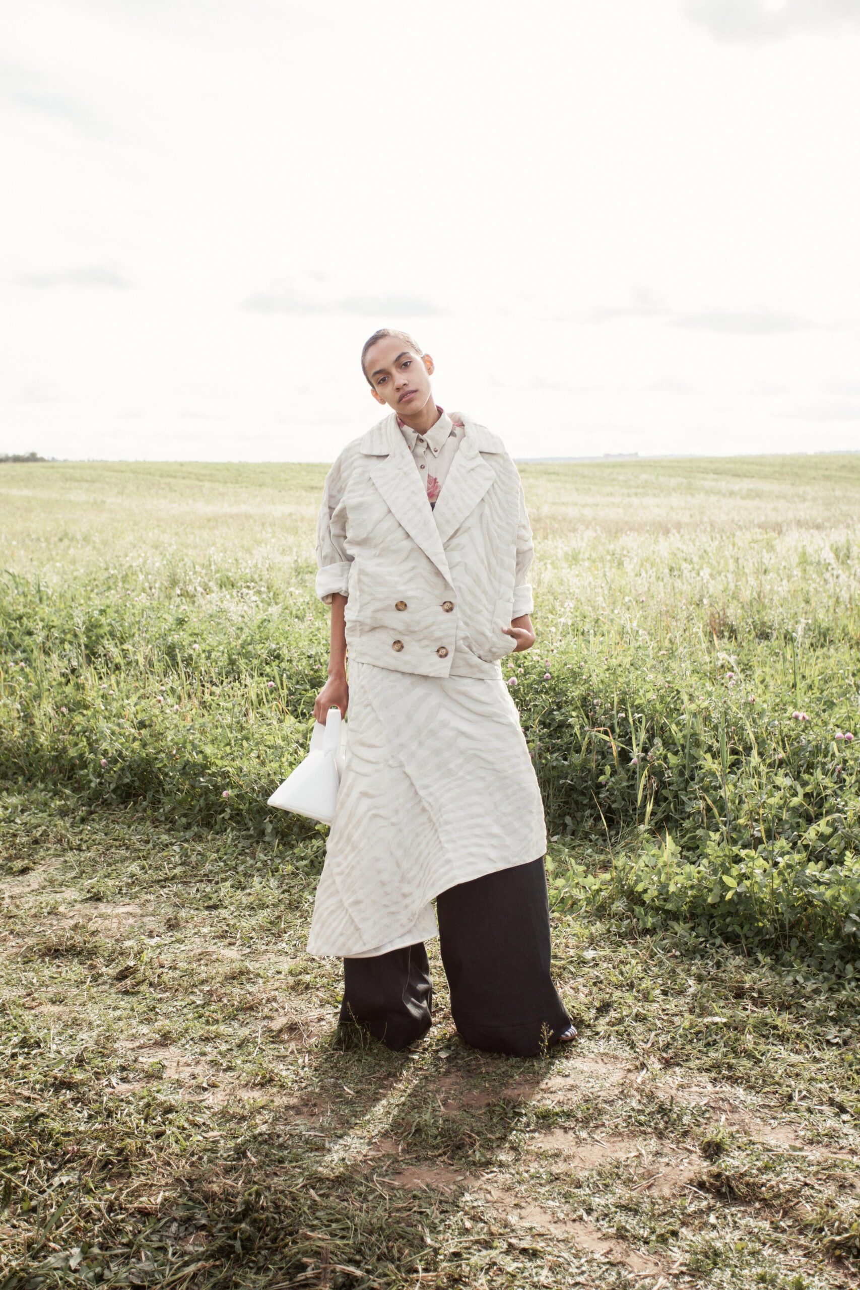 white oversized coat and black skirt