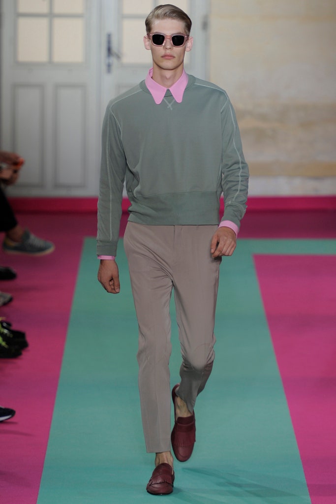 green fitted sweater with beige pants