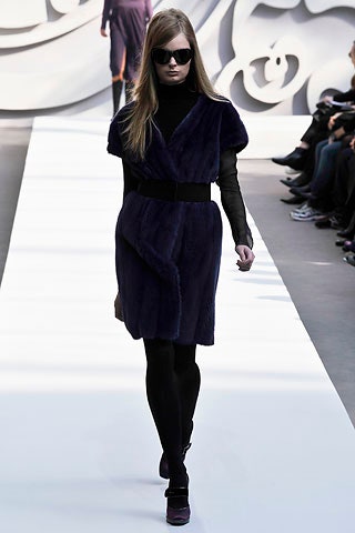 purple faux-fur coat with black turtleneck