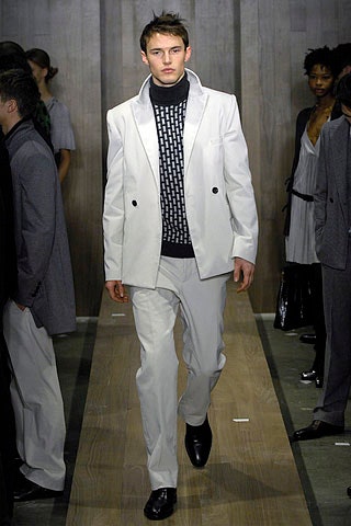 white tailored suit with black turtleneck