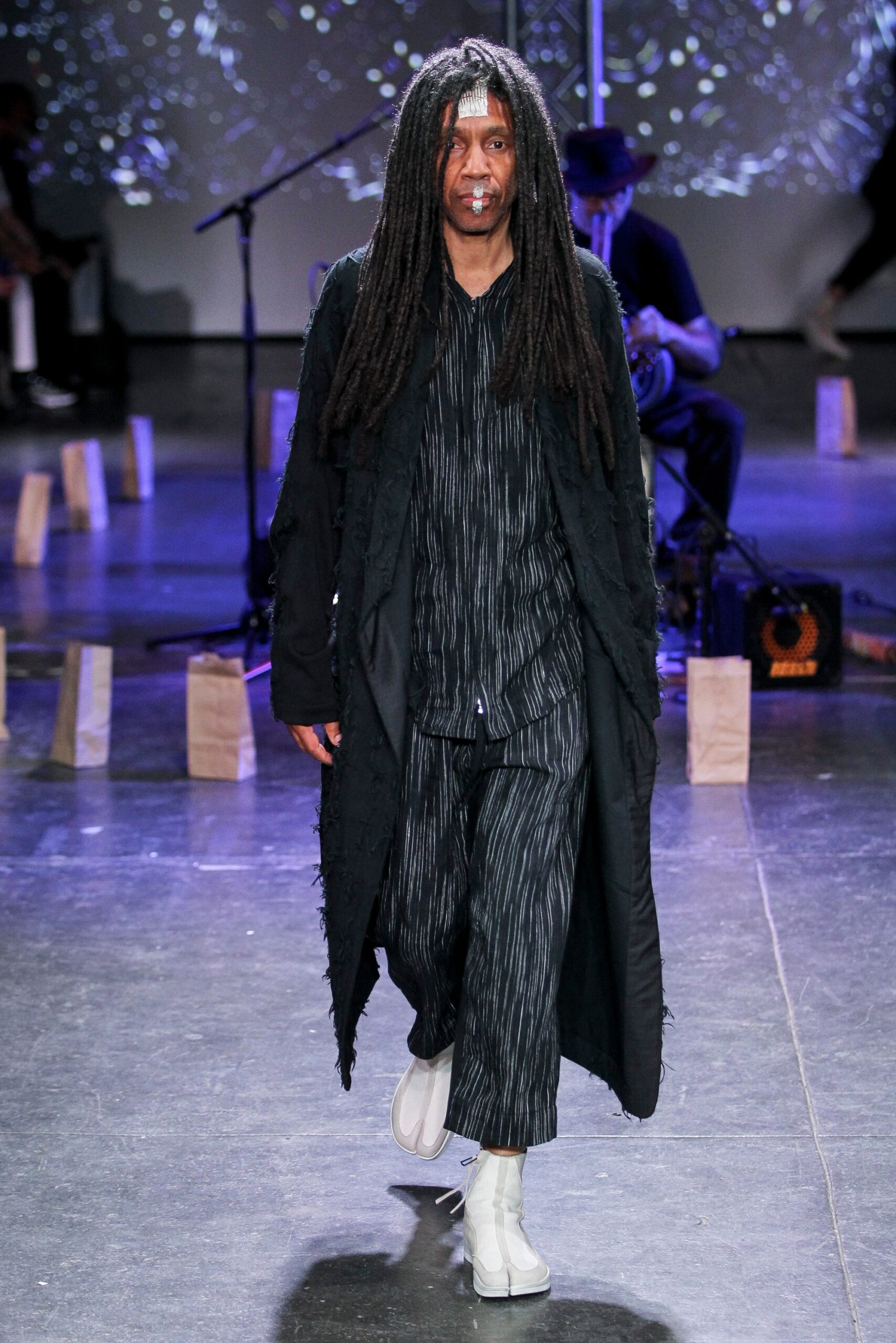 black relaxed coat with striped shirt