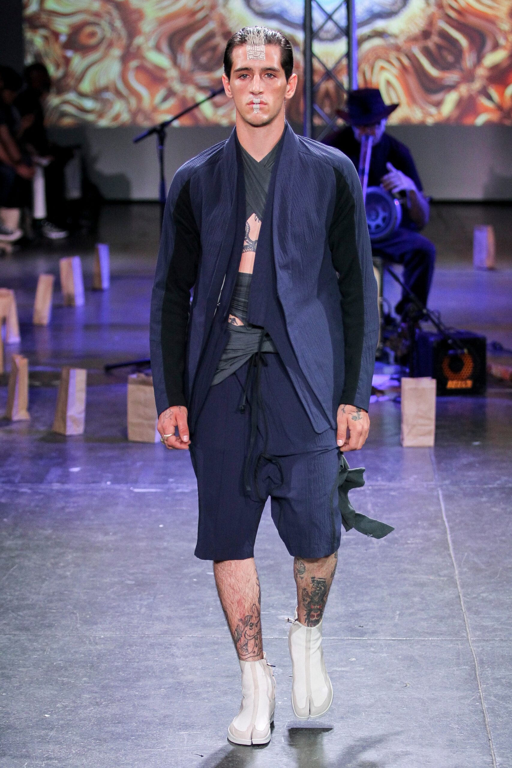 navy fitted jacket and shorts