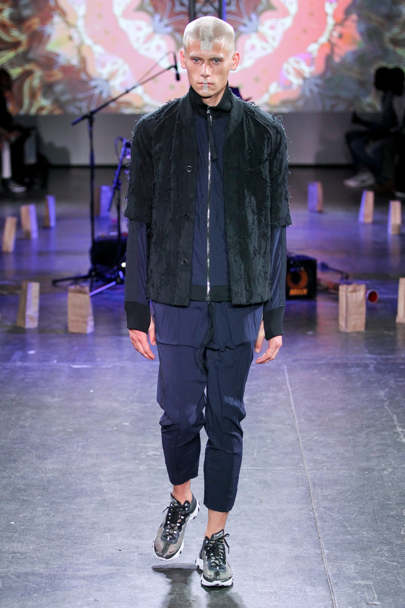 black relaxed jacket with blue pants