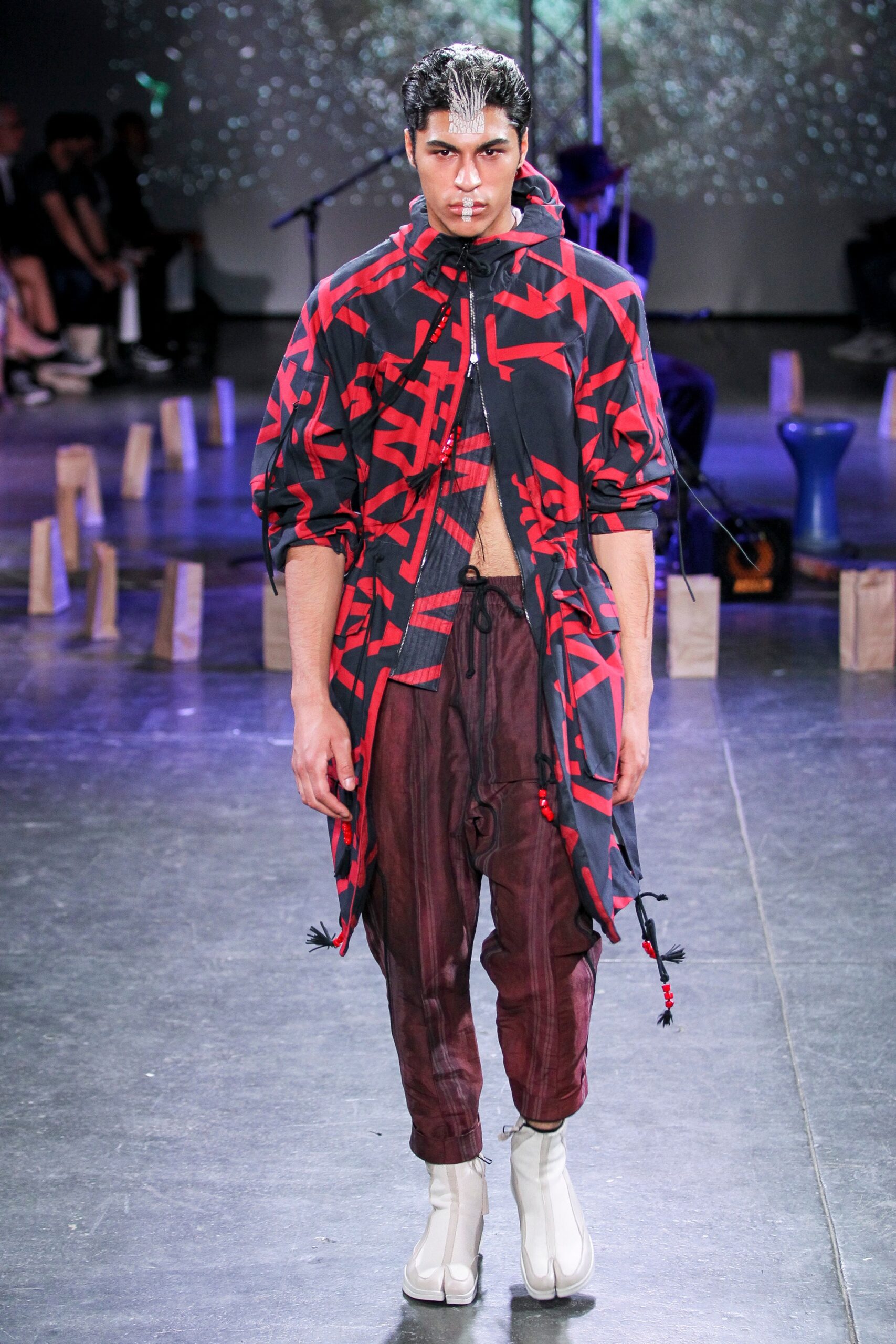 relaxed black and red jacket with brown pants