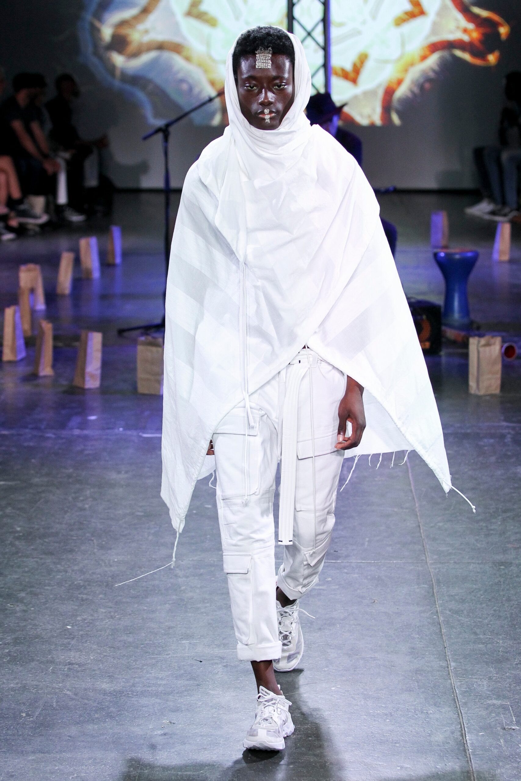 white cotton cape and cargo pants