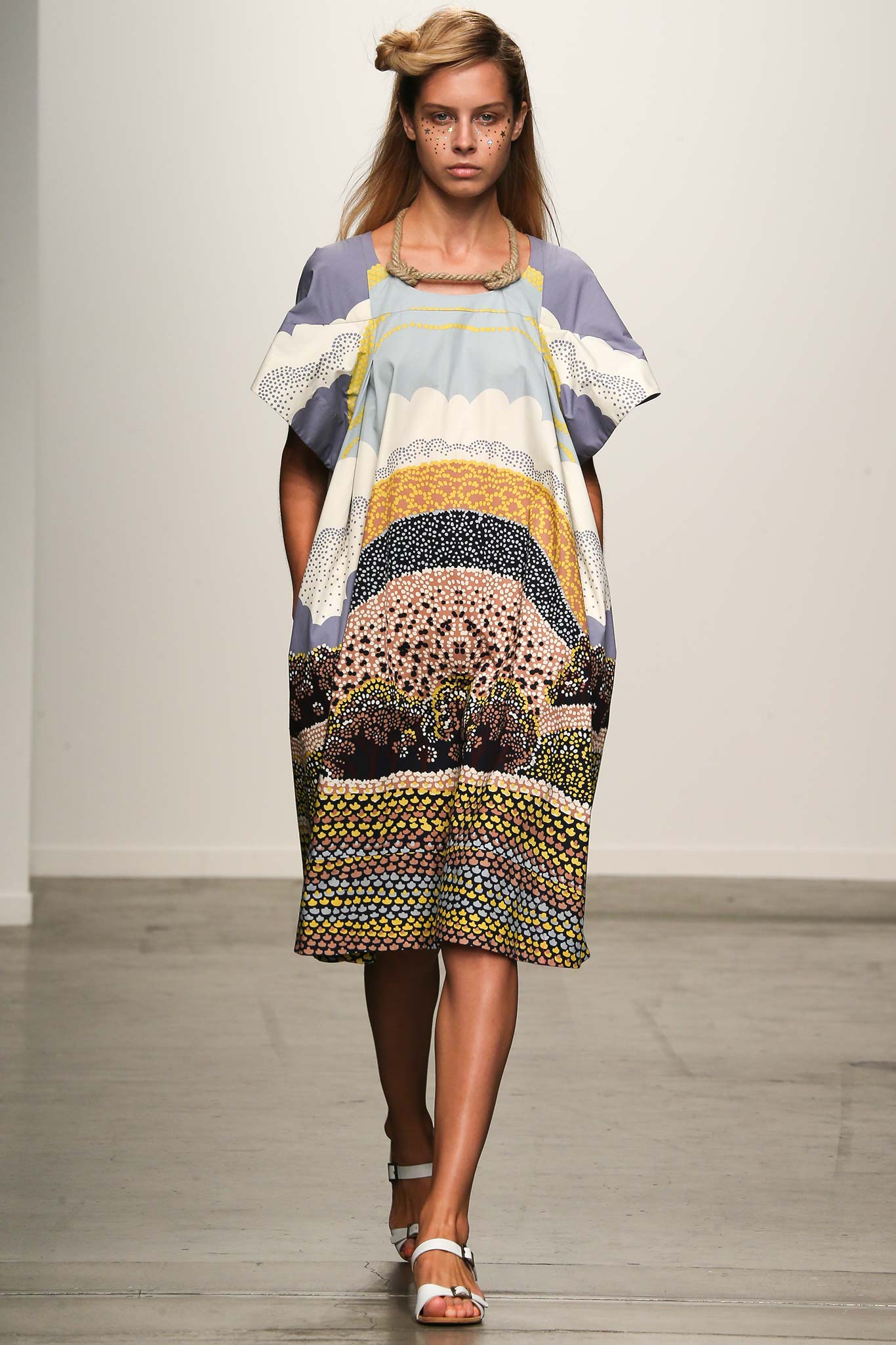 A relaxed multicolor cotton dress with short sleeves and a collared neckline featuring a printed design.