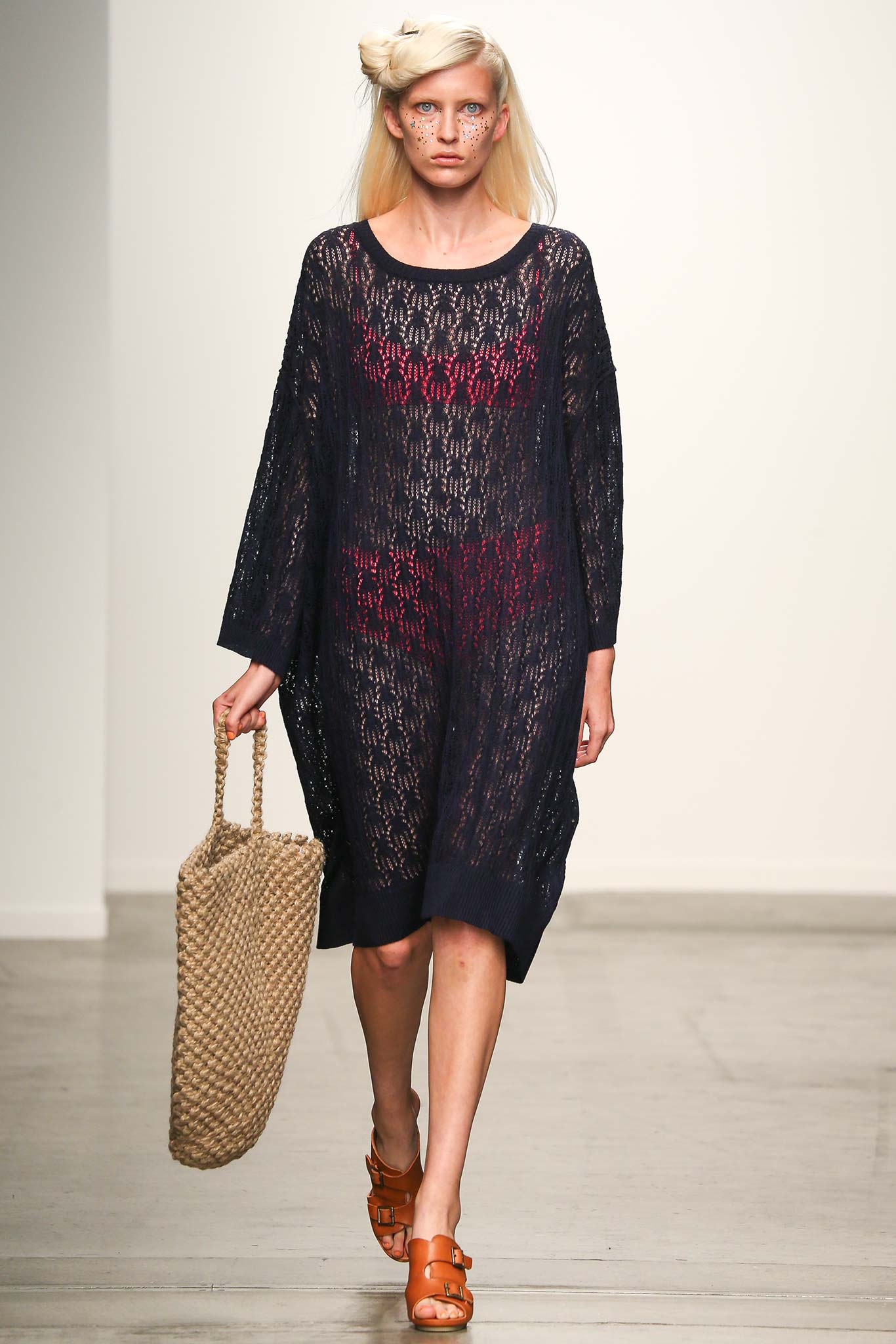 A relaxed black and red sheer dress with long sleeves and a V-neckline.