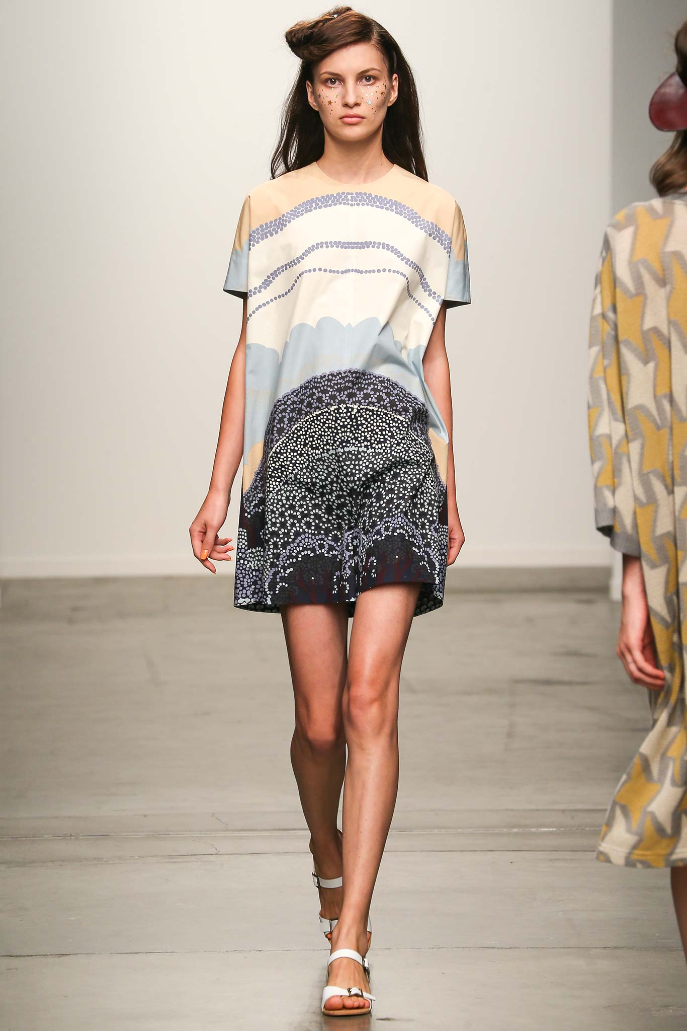 beige silk printed top with navy skirt